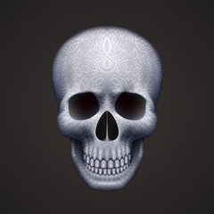 Human skull isolated on black with ornament