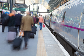 London Train Tube station Blur people movement in rush hour, at