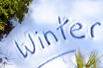 Winter word written in icy snow photo