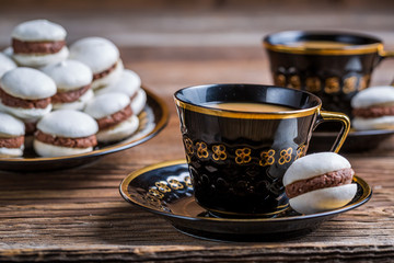Nut-chocolate macaroons served with coffee