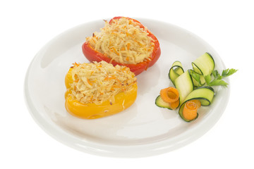 Red and Yellow stuffed peppers on dish isolated on white