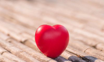 Fototapeta premium Red heart in Valentines with wood background.