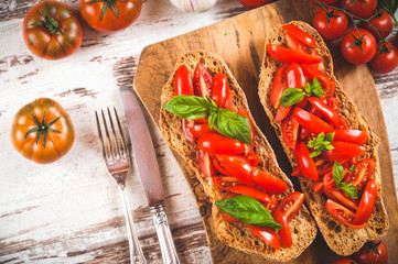 Italian starter, bruschetta with Sicilian red fresh tomato on a