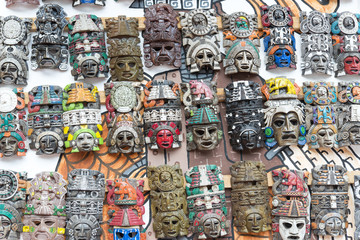 Mayan woodeMayan wooden handcrafted masks on the street market 