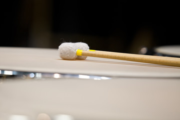Drumsticks lying on the timpani