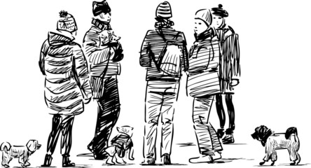 people with the dogs on a walk