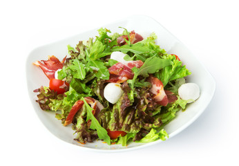 Restaurant food isolated - salad with spanish jamon and mozzarel