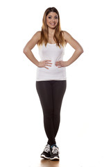 young women in tights and sneakers on a white background