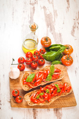 Italian starter, bruschetta with Sicilian red fresh tomato on a
