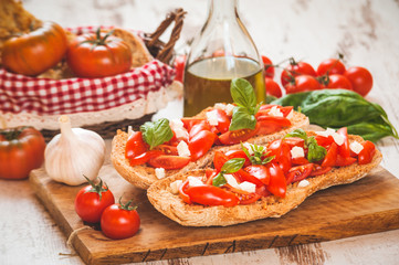 Italian starter, bruschetta with Sicilian red fresh tomato and m