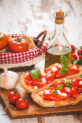 Italian starter, bruschetta with Sicilian red fresh tomato and m