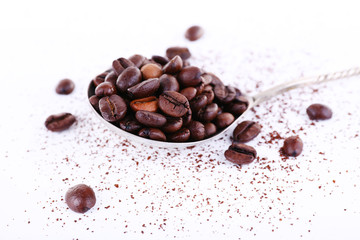 Coffee beans in spoon isolated on white