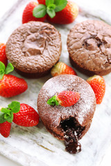 Hot chocolate pudding with fondant centre with strawberries,