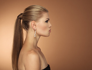 Portrait of fashionable woman with long hair tail in profile - 77068991