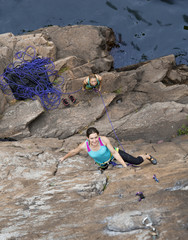 Group of female rock climbers makes and ascent on the rocky wall