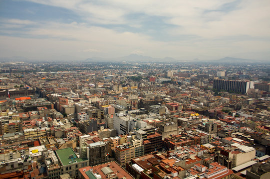 Mexico city DF aerial view with mountains and clouds