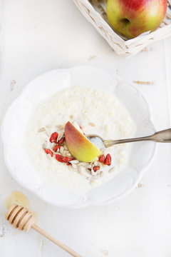 millet porridge with milk,goji berries, apple, honey and seeds