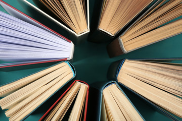 Naklejka premium Group of books on colorful background, top view