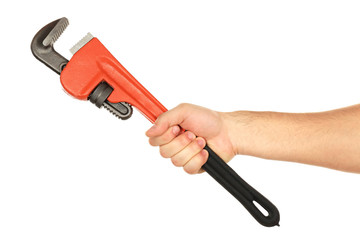 Plumbing wrench in male hand isolated on white