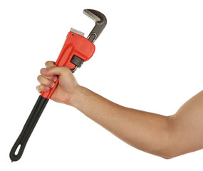 Plumbing wrench in male hand isolated on white