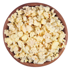 Fresh popcorn in a wooden bowl on a white