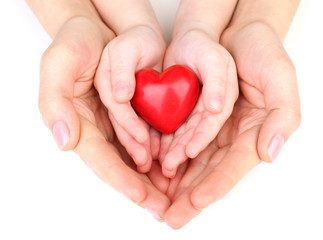Heart in child and mother hands isolated on white