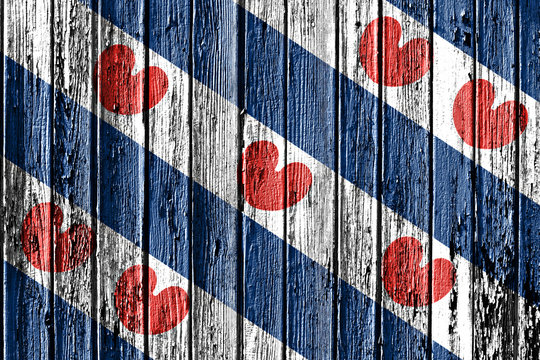 flag of Friesland painted on wooden frame