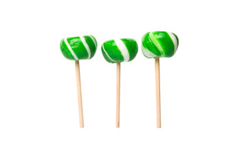 Green swirl peppermint candies over white background