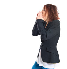 Redhead girl shouting over white background