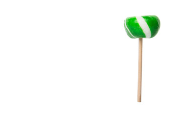 Green swirl peppermint candies over white background