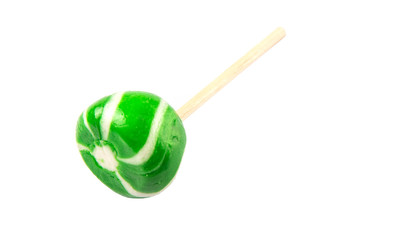 Green swirl peppermint candies over white background