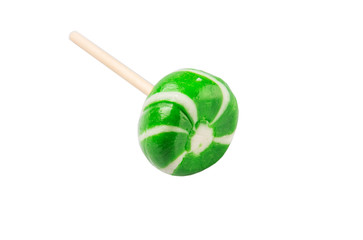Green swirl peppermint candies over white background