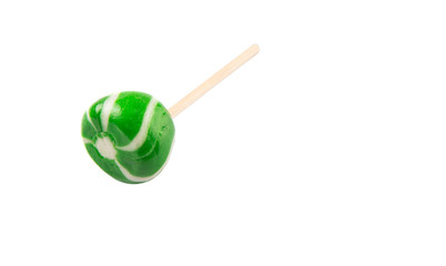 Green swirl peppermint candies over white background