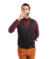 Fototapeta premium Man wearing waistcoat drinking wine