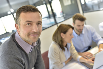 Businessman attending meeting with workteam