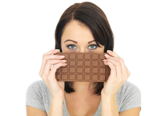 Young Woman Hiding Behind a Milk Chocolate Bar