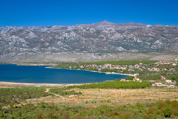 Obraz premium Rovanjska bay village and Velebit mountain