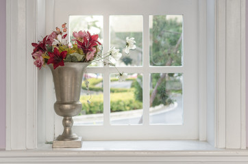 vase of flower with window frame