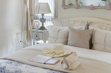 luxury bedroom with lamp on white table