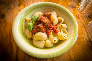 Lumache with pork sausage and tomato sauce, italian food