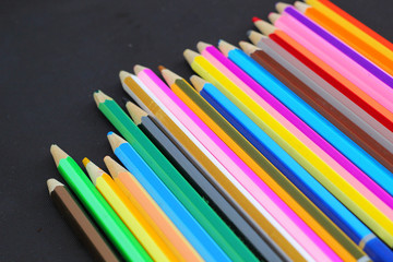 Fototapeta premium Colorful pencils on black background