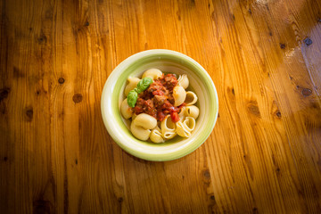 Lumache with pork sausage and tomato sauce, italian food