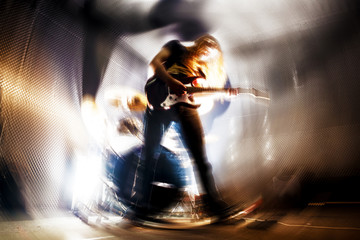 Fototapeta premium Tocando la guitarra. Fondo abstracto de música. Música rock