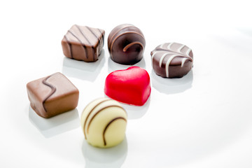 Heart shaped chocolate with other confectionery around