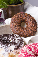 donuts with icing on a white napkin