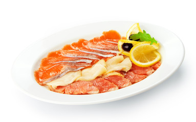 Restaurant food isolated - smoked fish assorted with lemon