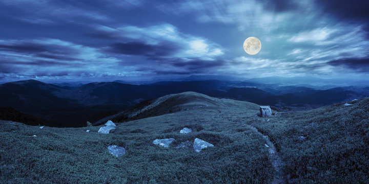path among stones on mountain top at night