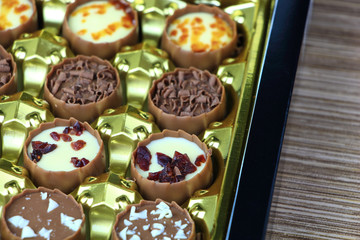 Assorted chocolate confectionery gift box on wood