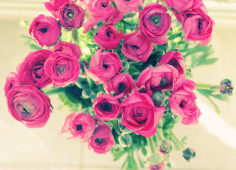 flowers in a glass vase by the window