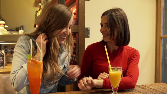 Happy excited woman showing her engagement ring to her friend